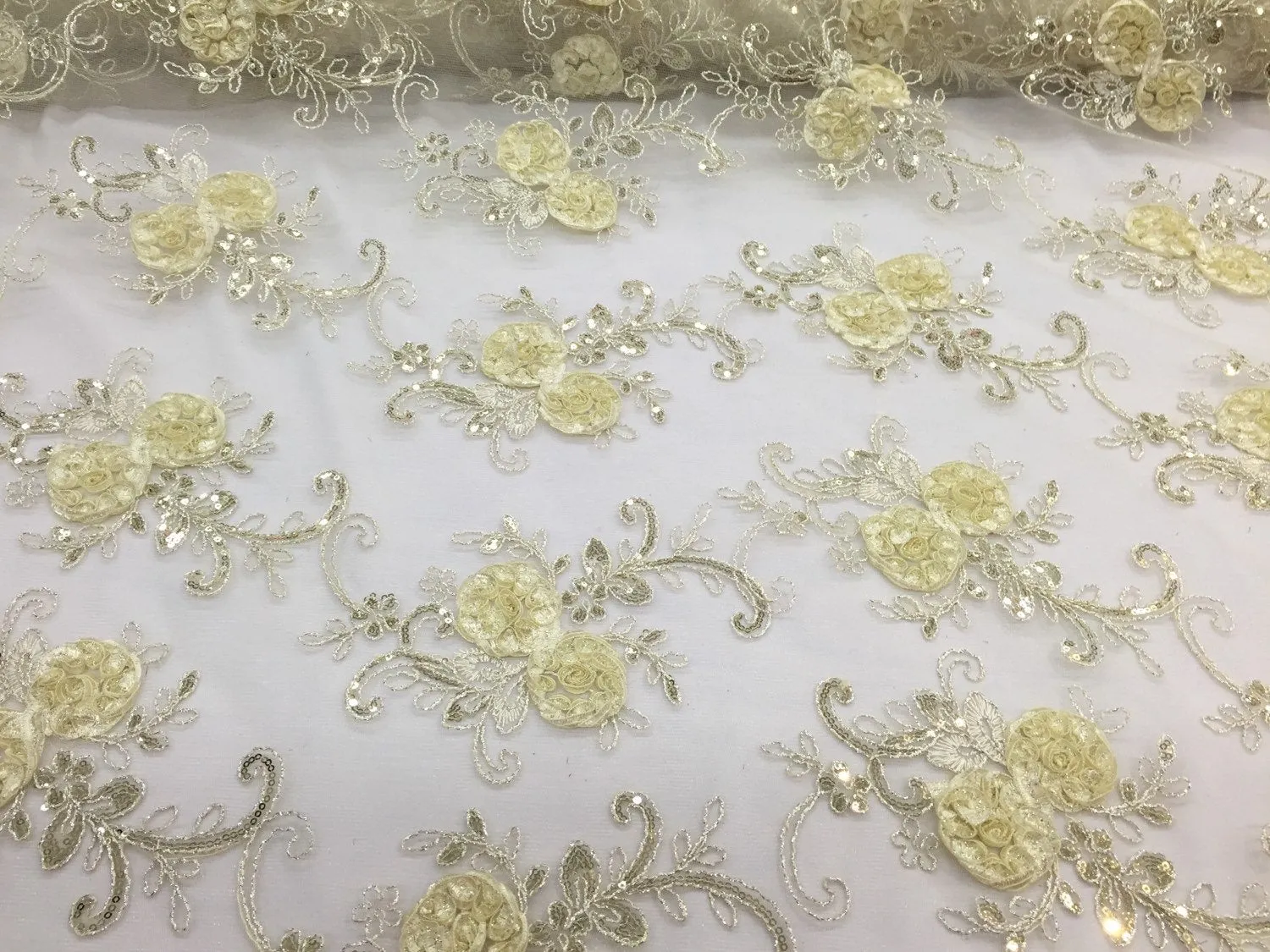 Ivory 3d flowers embroider with sequins on a mesh lace fabric. Sold by the yard.